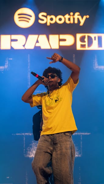 Paal Dabba mid rap on a stage for Spotify's Rap 91 party